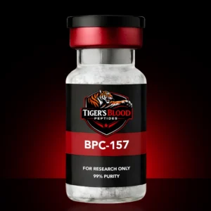 Vial of white powder labeled 'Tiger's Blood Peptides' with 'BPC-157', 'For research only', and '99% purity' on a red-black label against a dark background.